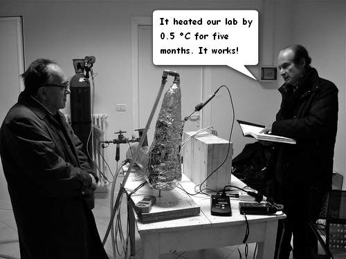 Sergio Focardi (left) and Andrea Rossi (right) in front of their Model 1 E-Cat in their Bologna laboratory. Click here for other E-Cat satire and images
